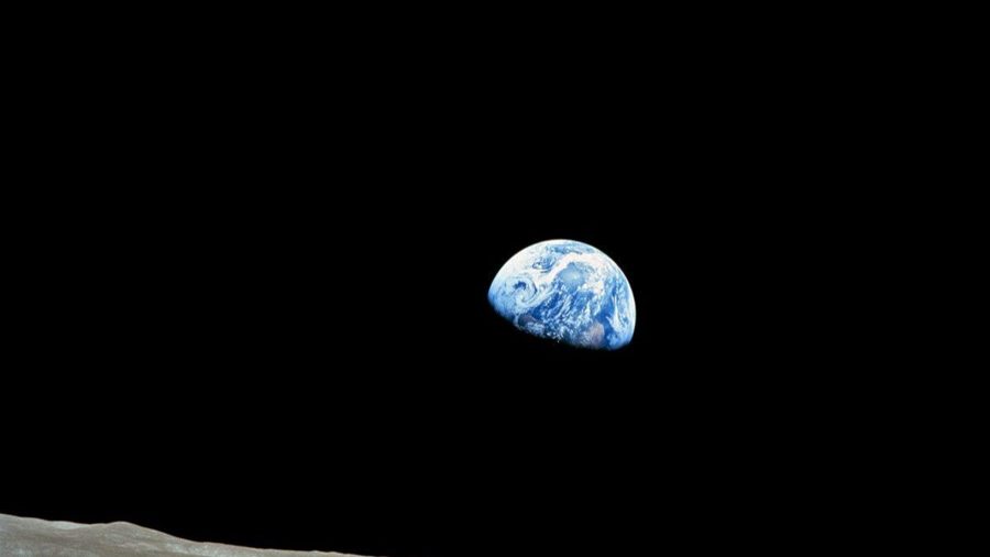 Earthrise over the limb of the Moon